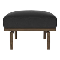 Black upholstered ottoman with a minimalist wooden base, featuring clean lines and a modern design.