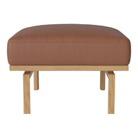 Brown leather ottoman with smooth textures and light wooden legs. Modern design perfect for any living space.