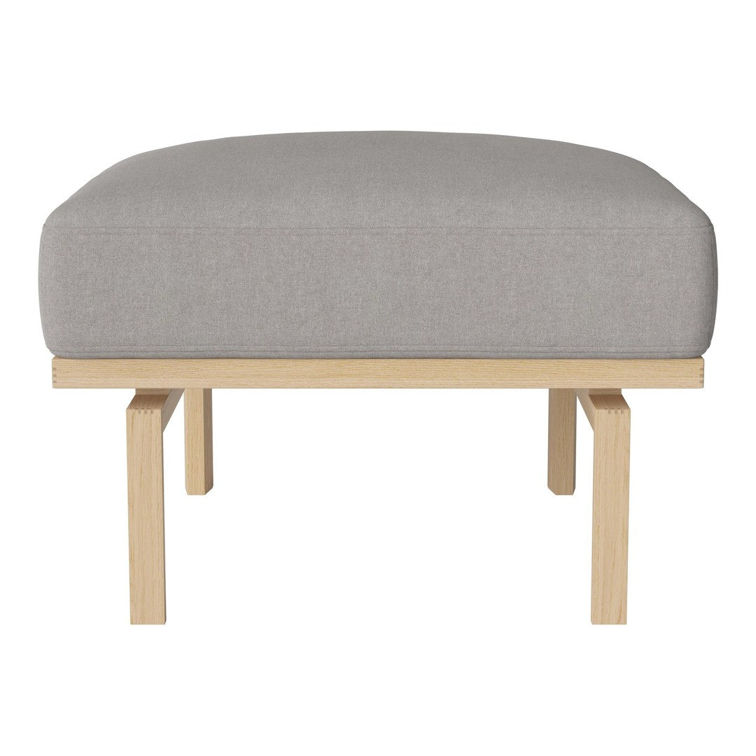 Gray upholstered ottoman with a smooth texture and natural wooden legs, featuring a minimalist design.