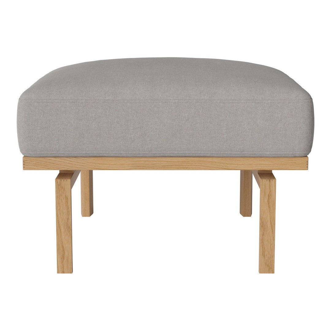 Gray upholstered ottoman with a smooth texture, featuring a light wooden base and minimalist design.