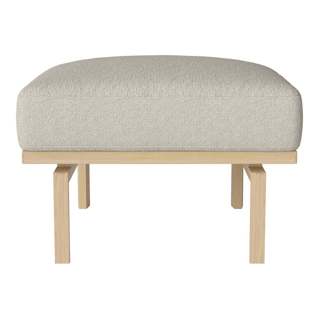 Beige upholstered ottoman with a simple wood base, ideal for modern and minimalist decor.