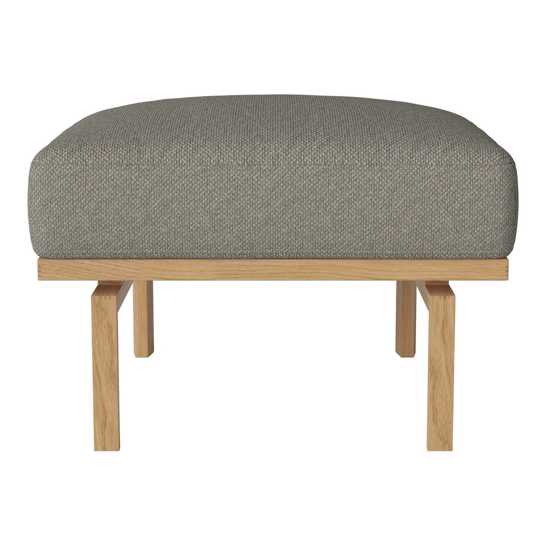 Gray upholstered ottoman with a smooth texture, featuring a natural wood base for a modern, minimalist look.