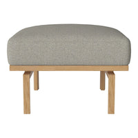 Light grey patterned upholstery on a curved ottoman with natural wood legs. Modern and stylish design for any space.
