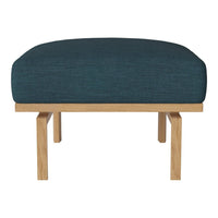 Teal upholstered ottoman with a textured finish and natural wood legs, featuring a modern, minimalist design.