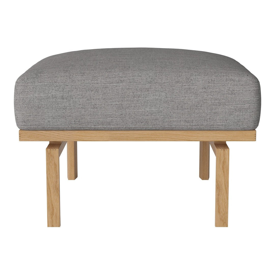 Gray upholstered ottoman with a smooth texture and natural wood legs, featuring a minimalist design.