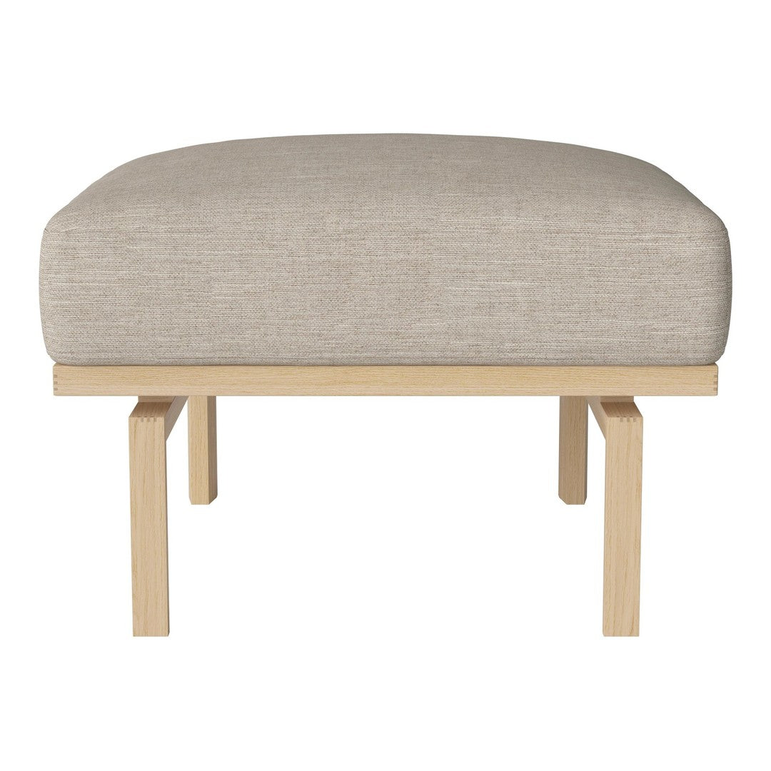 Beige upholstered ottoman with a simple wood frame, featuring a smooth, modern design.