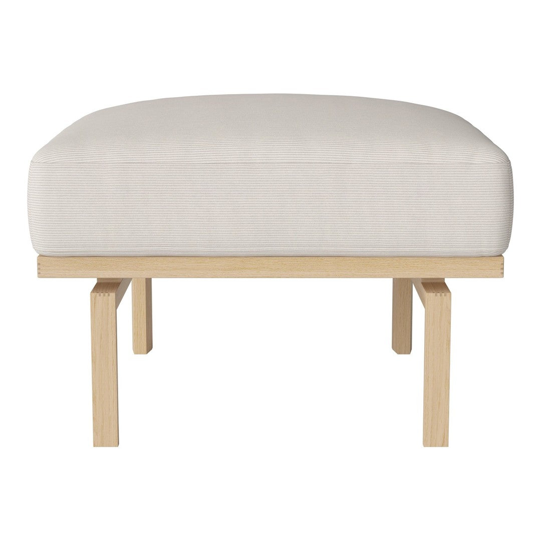 Light beige upholstered ottoman with a smooth finish and natural wooden legs. Minimalist design for versatile decor.