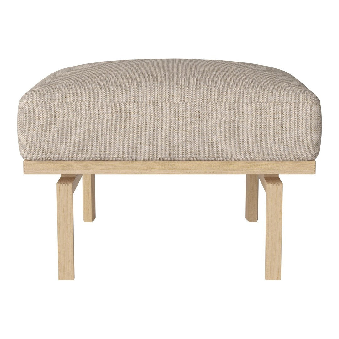 Beige upholstered ottoman with a textured pattern and light wooden legs, offering a modern, minimalist look.