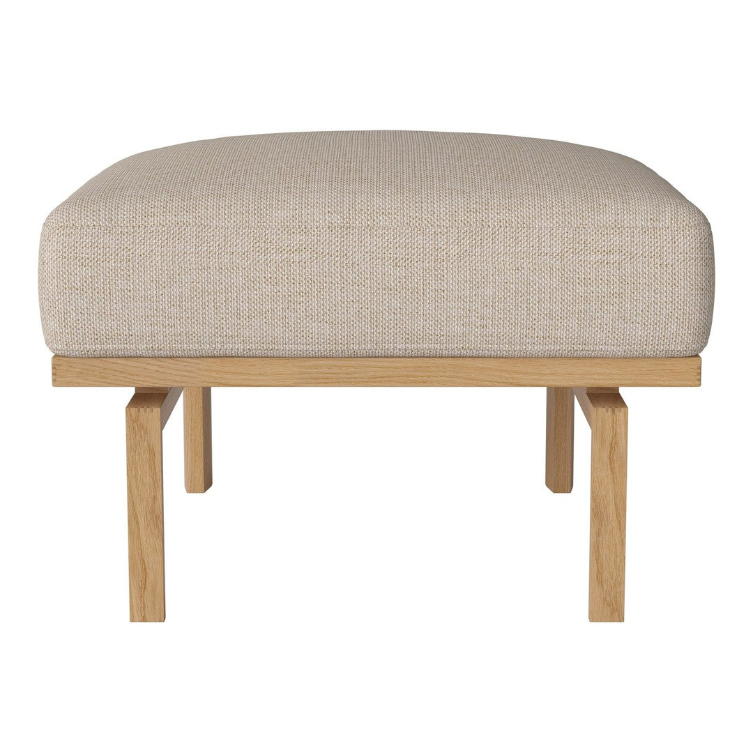 Beige upholstered ottoman with a textured finish and natural wood legs. Perfect for modern, minimalist decor.
