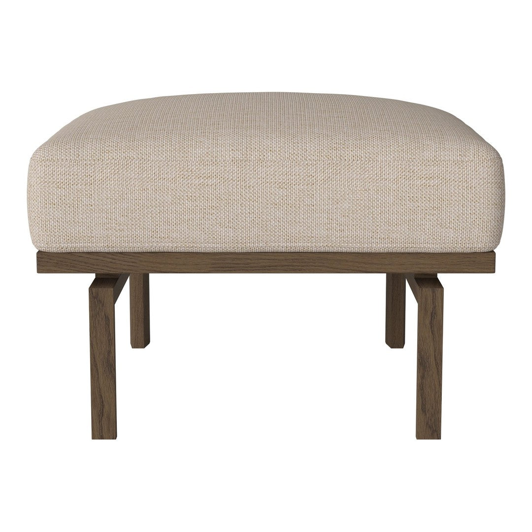 Neutral beige upholstered ottoman with a simple, minimalistic design and dark wooden legs.