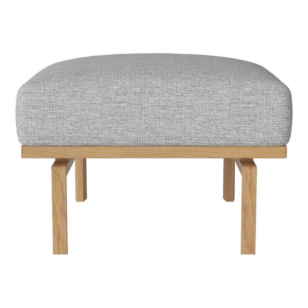 Grey upholstered ottoman with a textured pattern on a natural wood base. Modern and minimalist design.