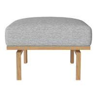Grey upholstered ottoman with a textured pattern on a natural wood base. Modern and minimalist design.