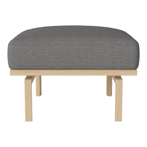 Gray upholstered ottoman with a clean, minimalist design and light wooden legs. Ideal for modern interiors.