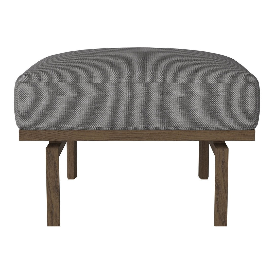 Gray upholstered ottoman with a textured pattern and dark wood legs. Versatile and stylish for any decor.