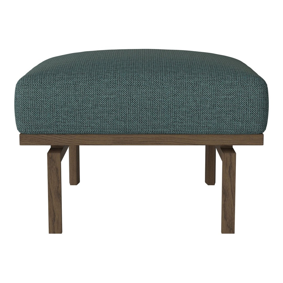 Teal upholstered ottoman with a textured pattern and a dark wooden frame. Ideal for modern decor.