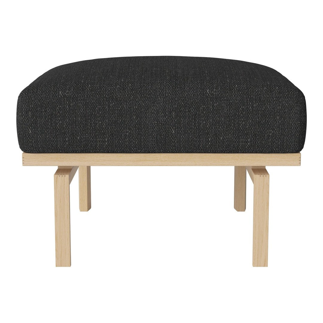 Black upholstered ottoman with a textured finish and light wooden legs, offering a modern, minimalist design.