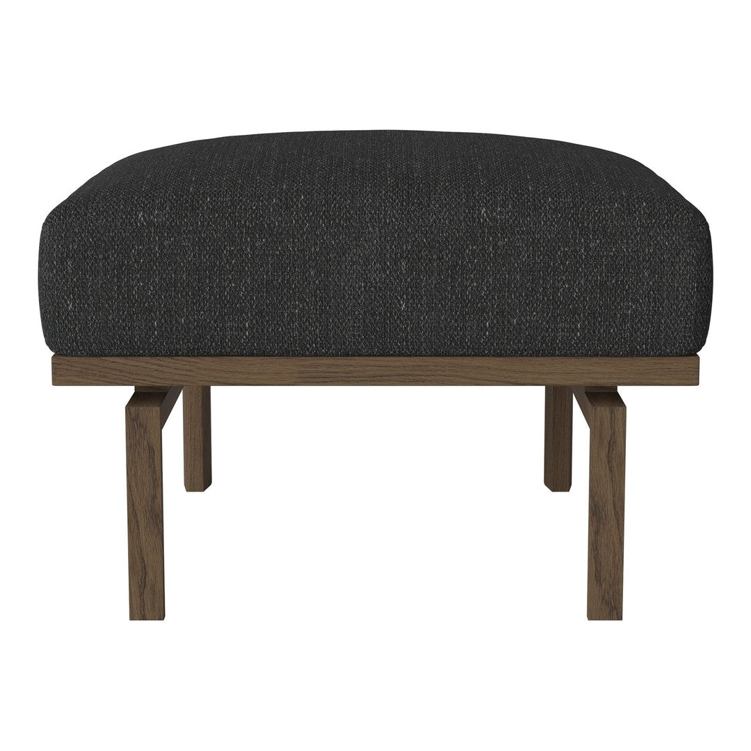 Black upholstered ottoman with a textured surface and wooden legs, blending modern style with comfort.