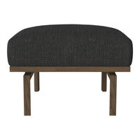 Black upholstered ottoman with a textured surface and wooden legs, blending modern style with comfort.