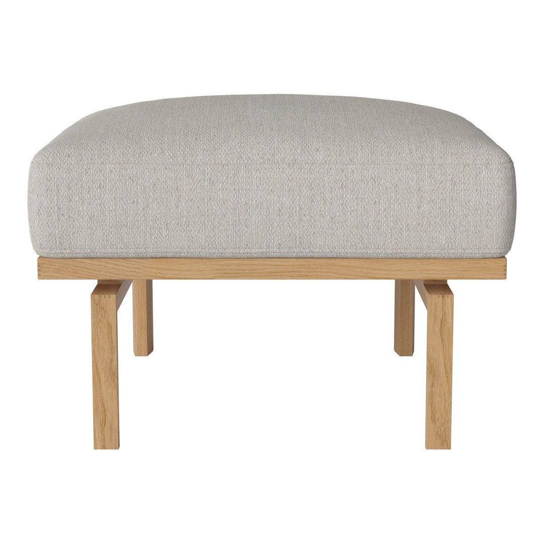 Light gray upholstered ottoman with a simple, modern design and natural wood legs. Perfect for versatile decor.