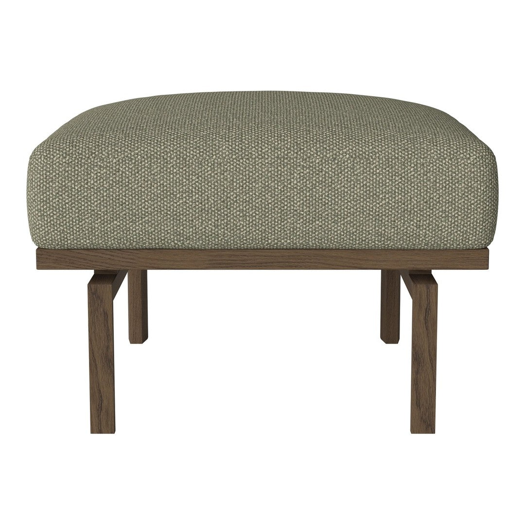 Neutral green upholstered ottoman with a textured finish and a solid wood base. Perfect for modern decor.