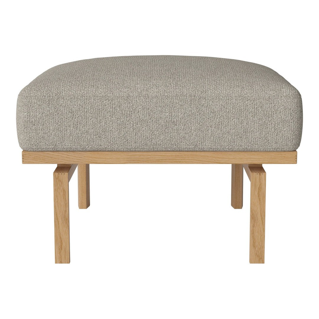 Gray upholstered ottoman with a minimalist design and natural wood legs. Soft texture, simple and modern style.