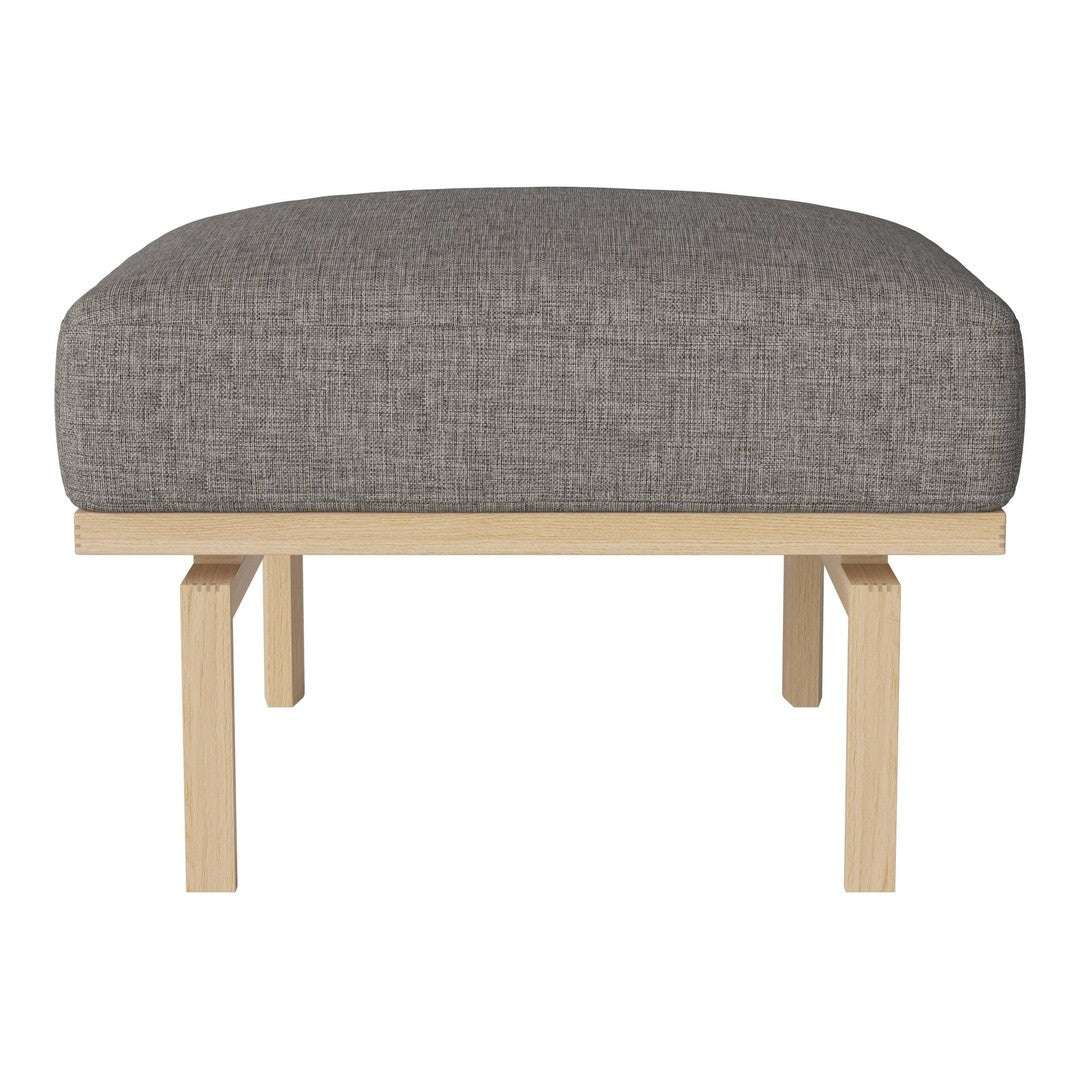Gray fabric ottoman with a smooth texture and light wood legs. Modern design for versatile home decor.