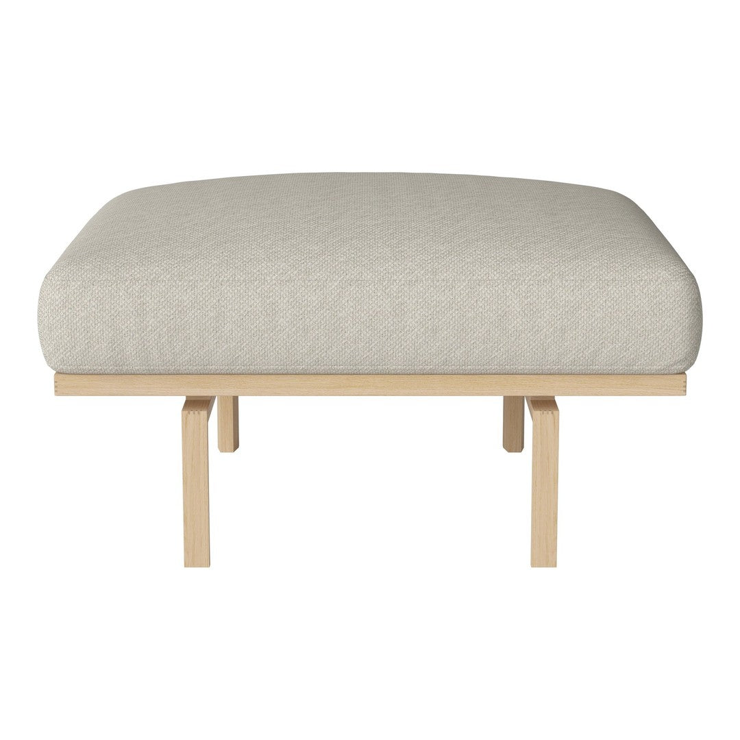 Light gray cushioned ottoman on a natural wood base, featuring a smooth, minimalistic design.