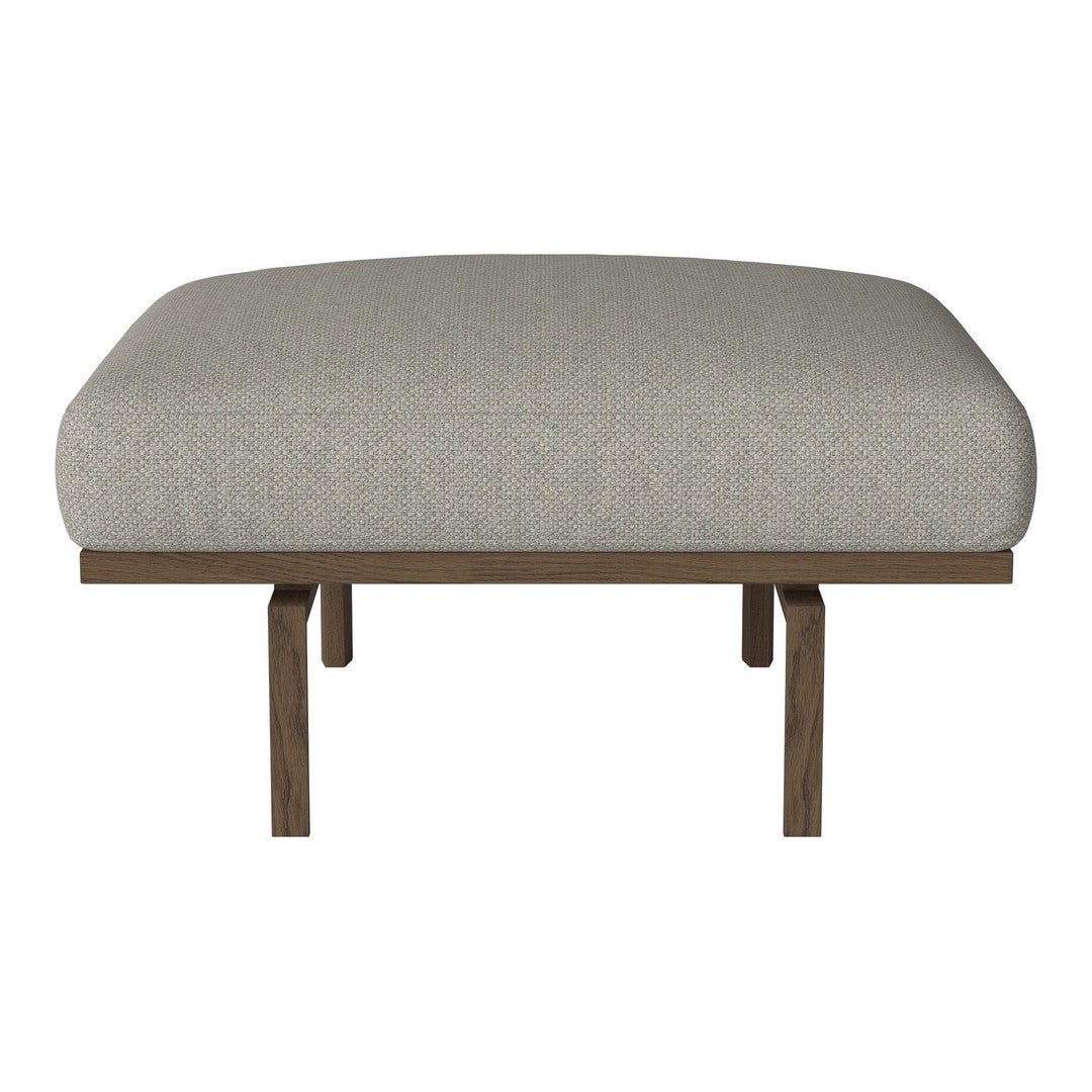 Light gray upholstered ottoman with a smooth texture and wooden legs, perfect for modern decor.