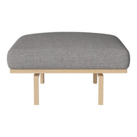 Gray upholstered cushion atop a sleek, light wood frame. Minimalist design with a modern, neutral color palette.