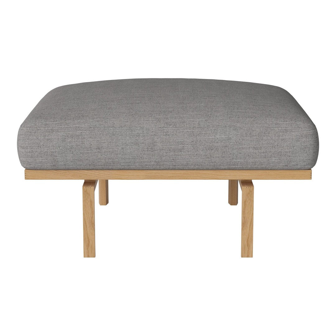 Gray cushioned bench seat with a smooth texture, supported by natural wood legs, perfect for modern decor.