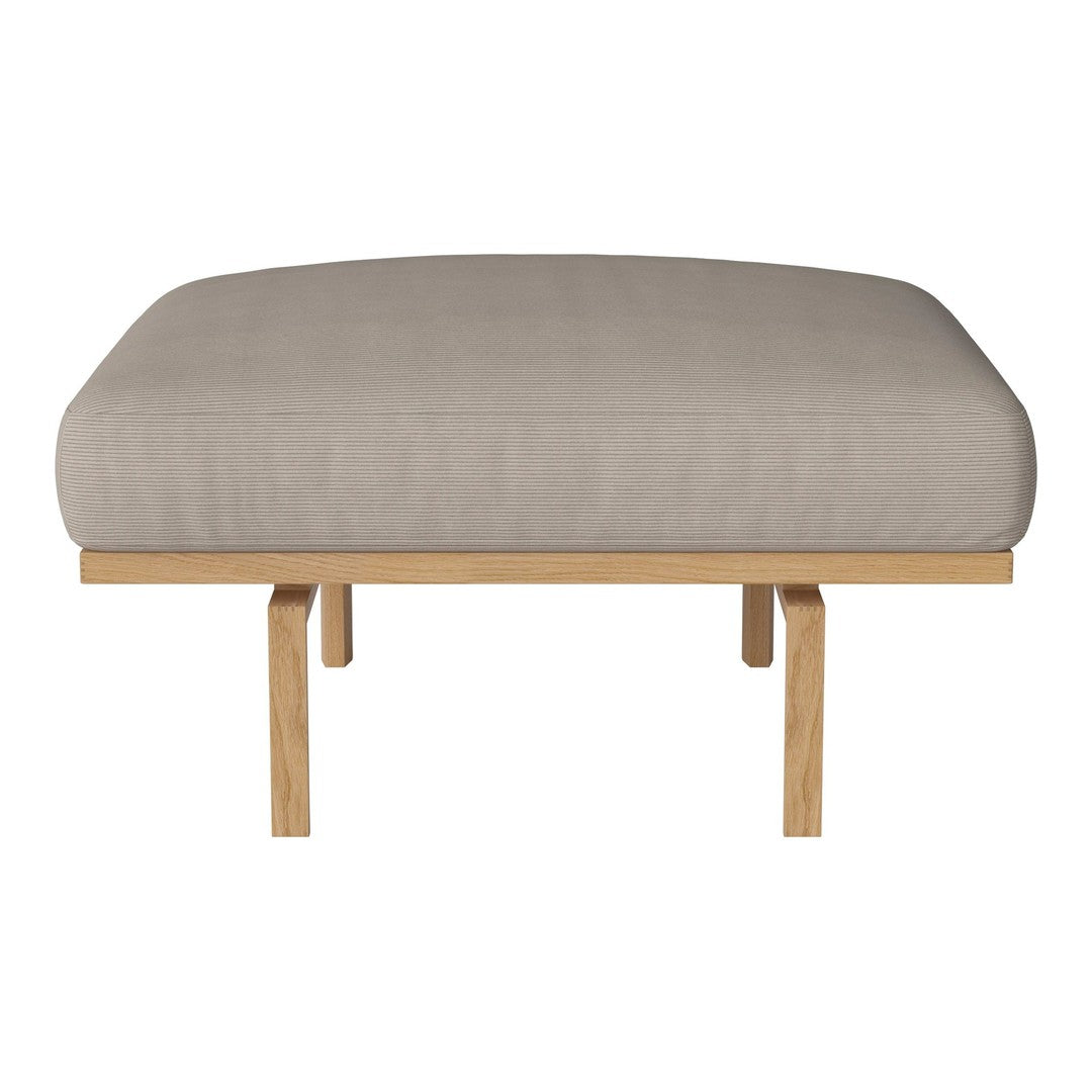 Beige upholstered bench cushion on a light wood frame. Simple, modern design with clean lines.