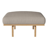 Beige upholstered bench cushion on a light wood frame. Simple, modern design with clean lines.