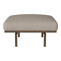 Beige upholstered stool with a smooth, solid surface and wooden legs. Minimalist design perfect for modern decor.
