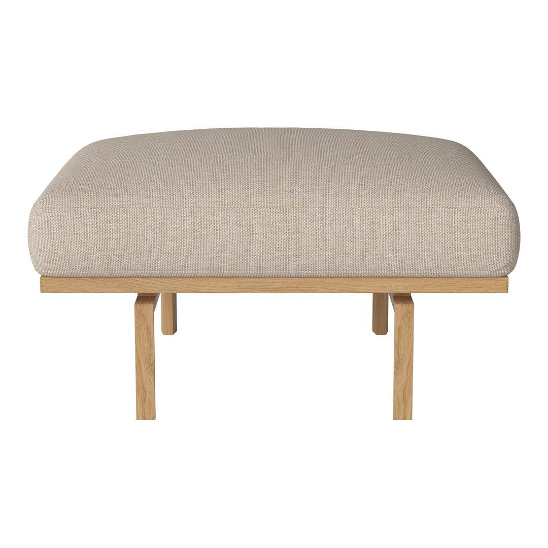 Beige upholstered ottoman with a smooth texture on wooden legs. Minimalist design, perfect for modern interiors.