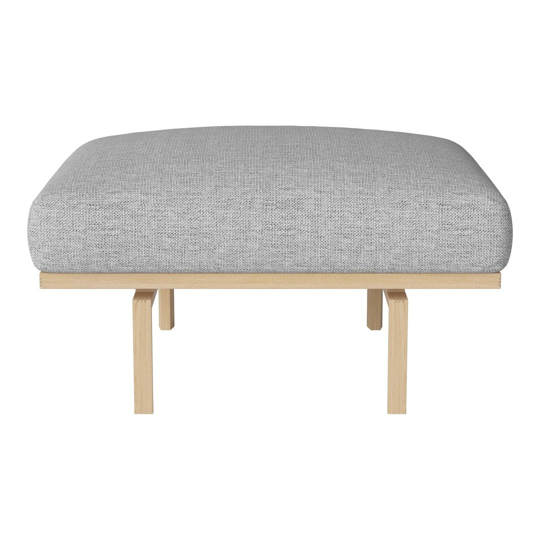 Gray upholstered cushion with a textured pattern on a natural wood base, minimalist design perfect for modern decor.