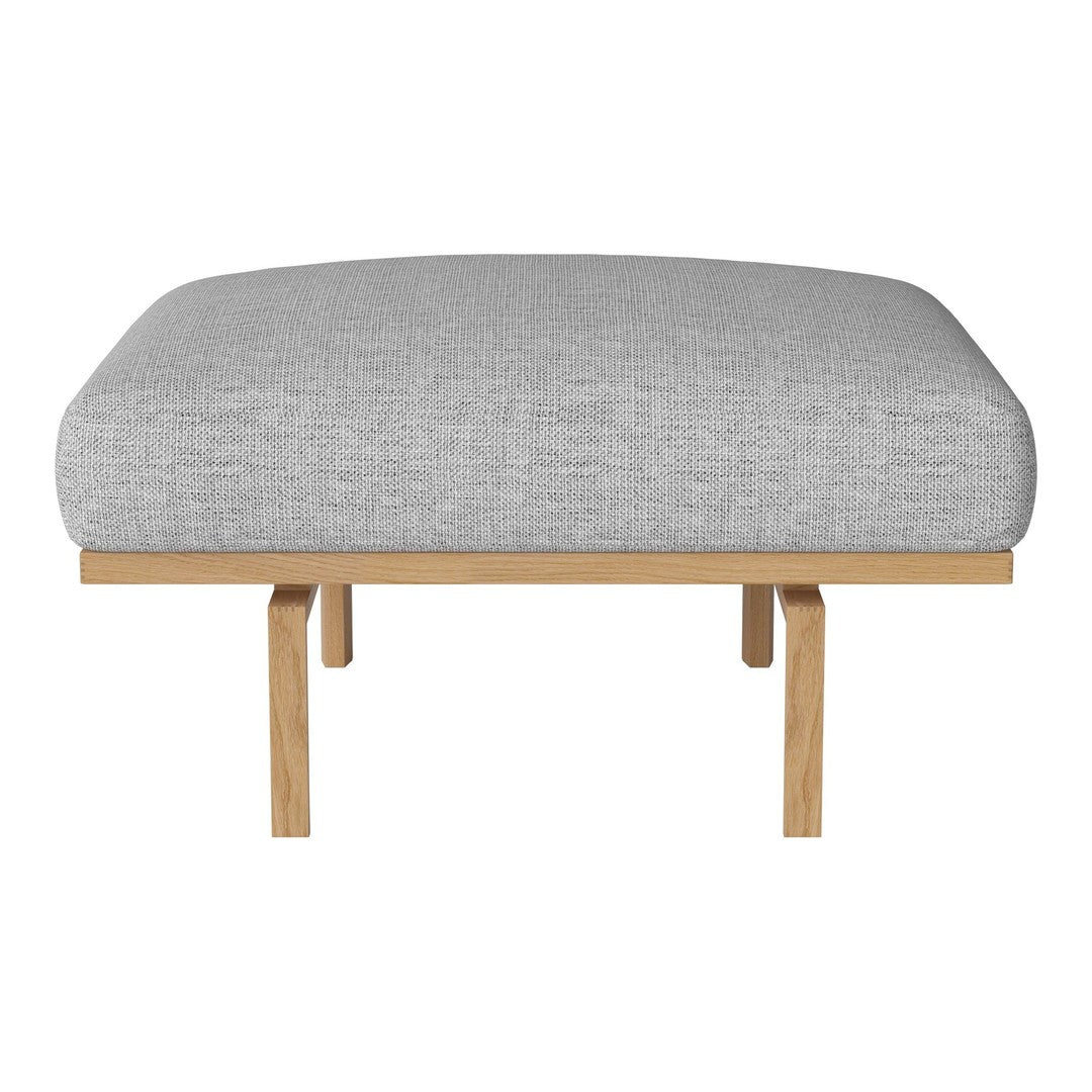 Light gray textured cushion with a smooth finish, supported by natural wood legs.