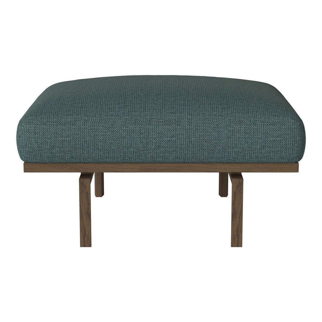 Teal upholstered chair with a textured fabric, featuring a natural wood frame and simple, modern design.