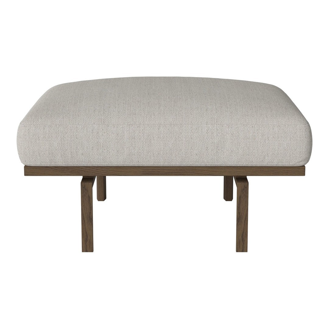 Light beige cushion with a smooth texture on a wooden base. Perfect for modern decor.