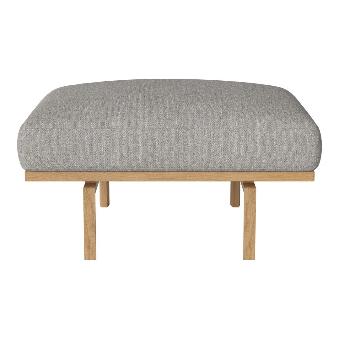 Light gray upholstered ottoman with a smooth texture and natural wood legs for a modern look.