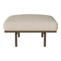 Light beige upholstered stool with a smooth, solid fabric pattern and contrasting dark wooden legs.