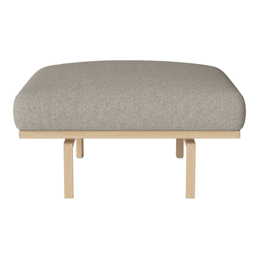 Light gray upholstered cushion with a smooth texture on a minimalist wooden frame.
