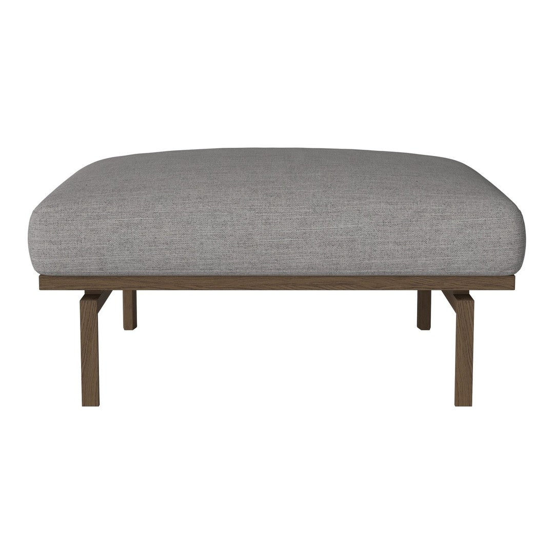 Gray upholstered ottoman with subtle texture and sleek brown metal legs. Perfect for modern decor.