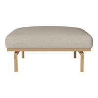 Beige linen cushion on a light wood frame, featuring a minimalist, sleek design and soft, rounded edges.