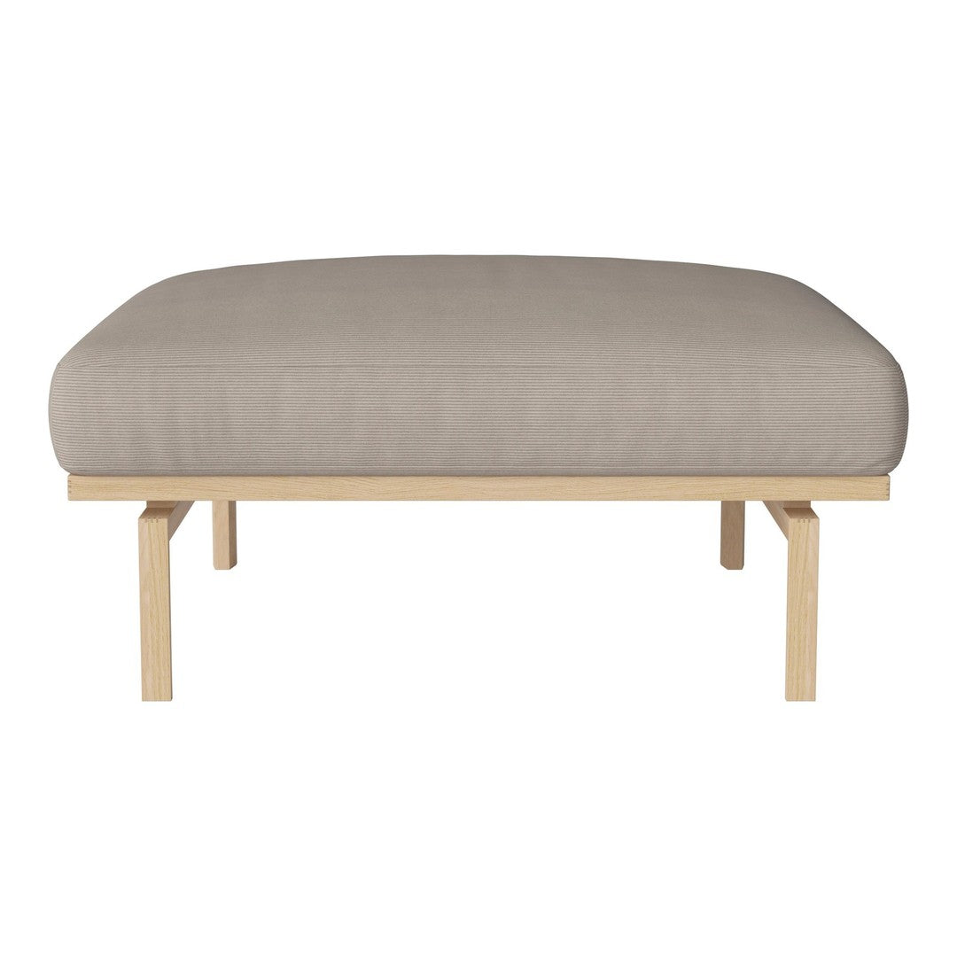 Beige cushioned sofa with a smooth, minimalist design and light wooden frame. Perfect for modern decor.