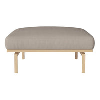 Beige cushioned sofa with a smooth, minimalist design and light wooden frame. Perfect for modern decor.