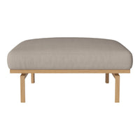 Beige cushioned ottoman with a smooth fabric surface, supported by natural wood legs. Modern and minimalist design.