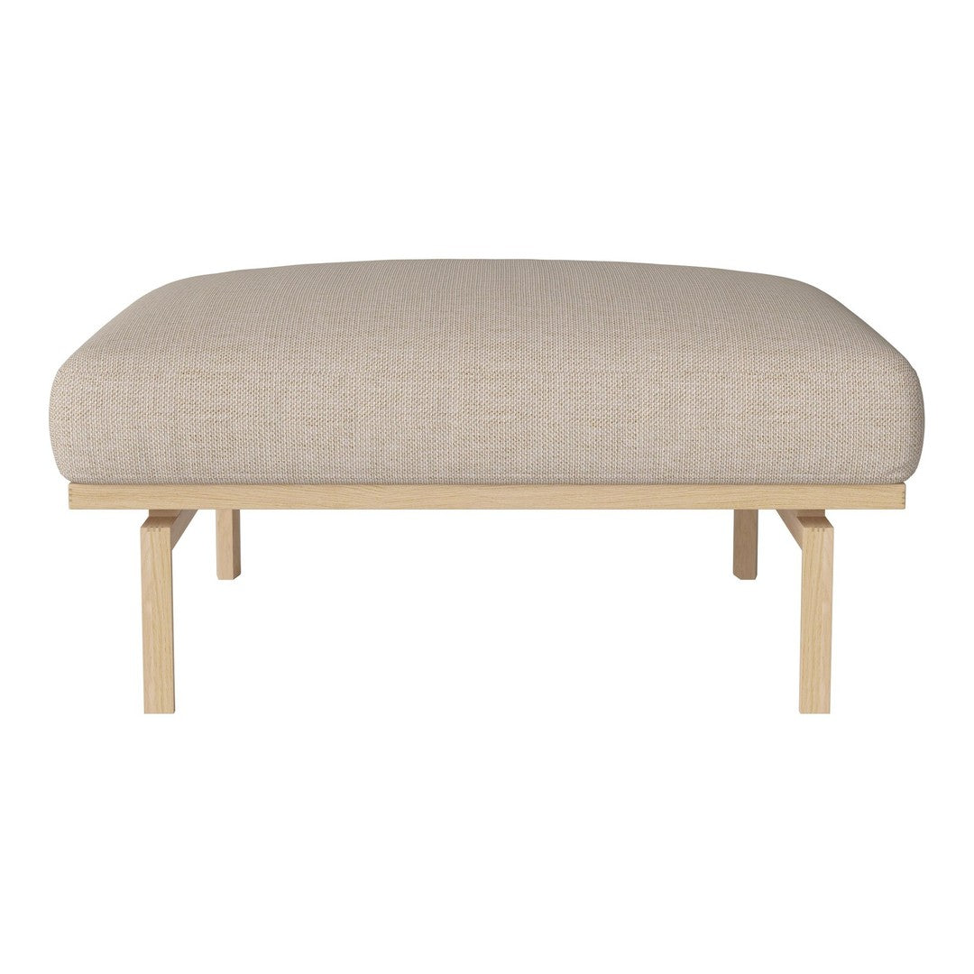 Beige upholstered ottoman with a smooth, textured fabric on a light wood frame. Simple and modern design.