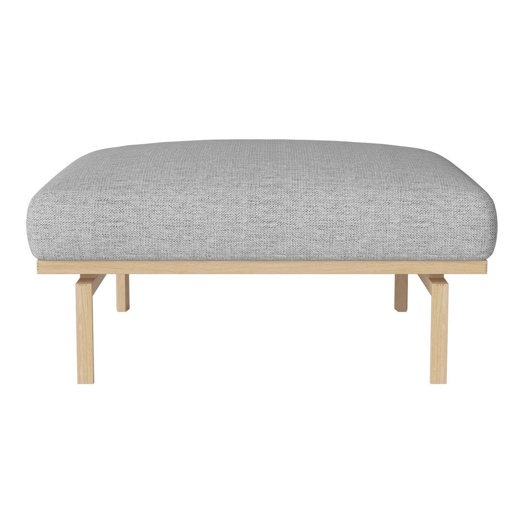 Gray upholstered ottoman with a smooth texture and light wood legs, perfect for modern decor.