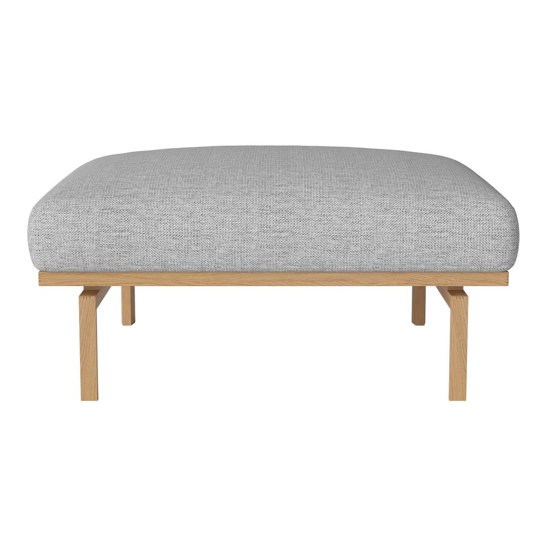 Gray upholstered ottoman with a smooth texture and minimalist design, featuring natural wooden legs.
