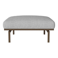 Grey upholstered ottoman with a textured finish and warm wood legs, perfect for modern decor.